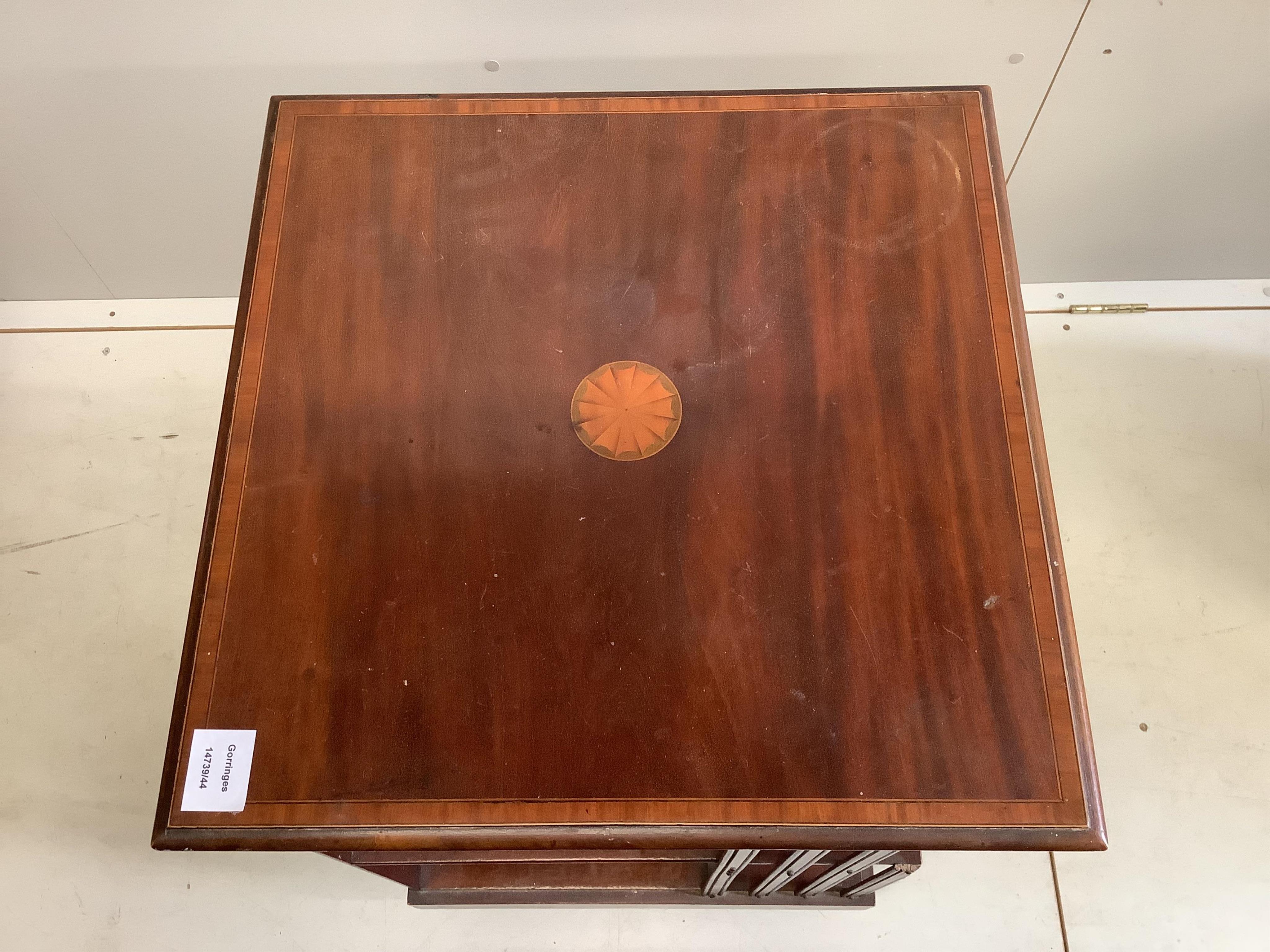 An Edwardian inlaid mahogany revolving bookcase, width 47cm, depth 47cm, height 84cm. Condition - poor